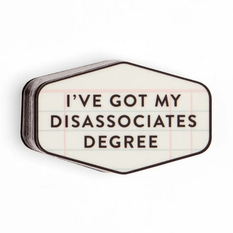 The Got My Disassociates Degree Decal Sticker delivers smart humor with a relatable twist. Made from durable, waterproof vinyl, this high-quality decal is perfect for laptops, water bottles, planners, notebooks, Kindles, phone cases, and more. The bold typography and clean design make it a standout accessory for students, graduates, and anyone fluent in sarcasm. Easy to apply and long-lasting, it’s built to stick through study sessions, workdays, and caffeine-fueled deadlines. A funny and giftable sticker f