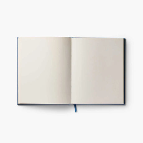 Our embroidered sketchbook is a large, hardcover journal with 108 unlined pages, perfect for sketching, drawing, and journaling. The cover is wrapped in blue book cloth and embroidered with our Gracie florals. Inside, an attached grosgrain ribbon bookmark will save your place.