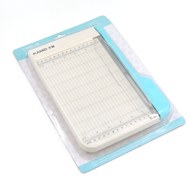 Built with a durable metal and plastic construction, this trimmer is perfect for craft rooms, classrooms, offices, and everyday projects. Its compact size makes it easy to store, while the sharp guillotine blade delivers smooth, straight cuts ideal for photos, cardstock, planner inserts, and more. Cleanly cuts 3 sheets of cardstock up to 9 inches.

Whether you're crafting, scrapbooking, or prepping materials for work, this cutter offers reliable performance in a convenient, easy‑to‑use design.