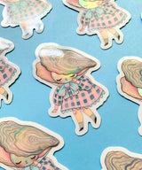 "Pearl" Vinyl Sticker made from Hannakin illustration with subtle holographic accents (on the face and oyster shell) with shiny gloss finish.

Made from a durable waterproof vinyl with a matte laminate that protects it from scratching, rain and sunlight.