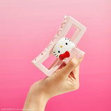 A playfully pink clip featuring Hello Kitty and her iconic red bow, perfect for adding her signature sweetness to your hairstyle.

Great for half-up styles, buns, and everyday updos. Lightweight, durable, and easy to wear!