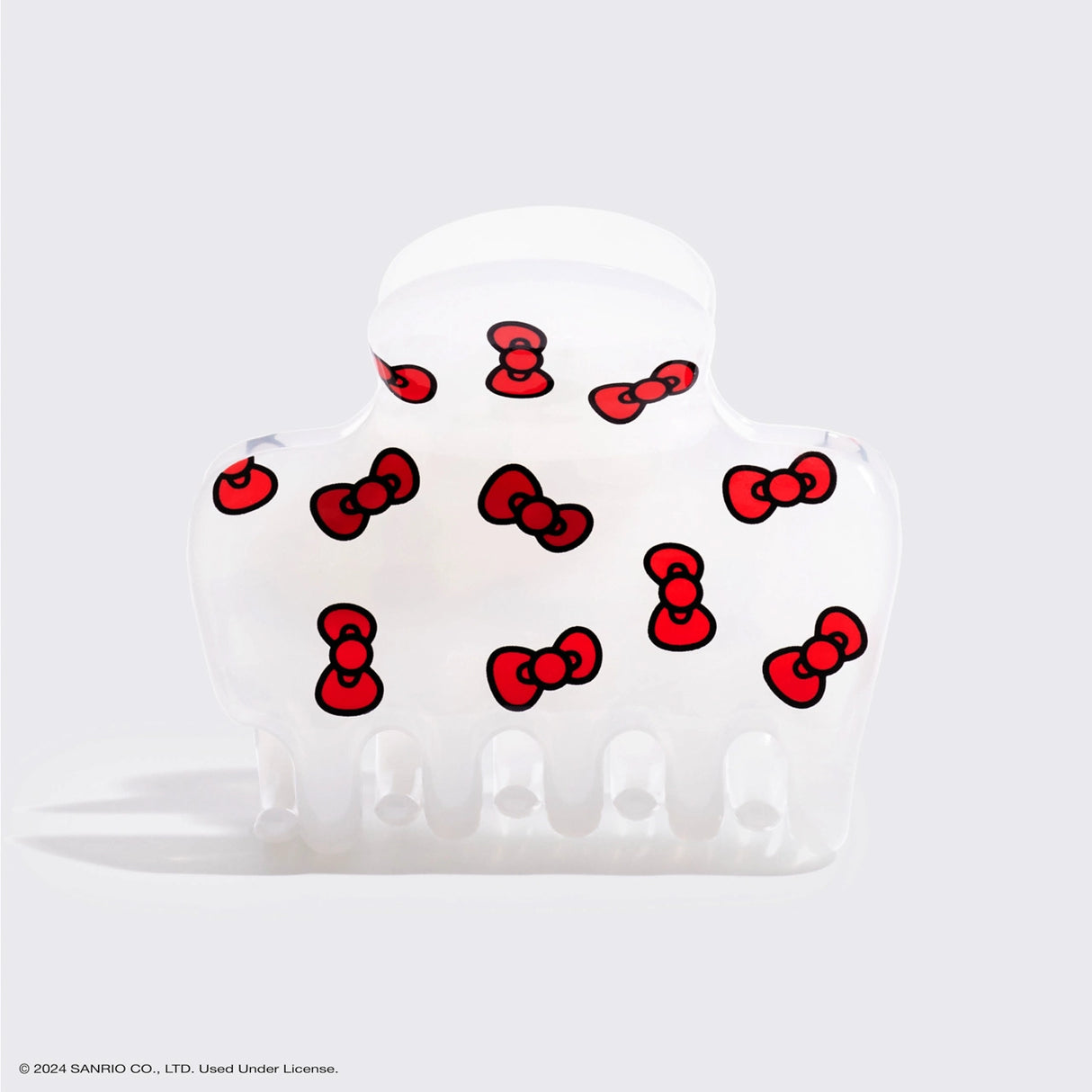 Add a touch of Hello Kitty playfulness to your hairstyle with this claw clip, featuring her signature red bows

Great for half-up styles, buns, and everyday updos. Lightweight, durable, and easy to wear!