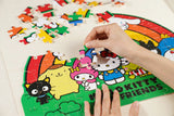 Discover the charm of the Hello Kitty Wooden Jigsaw Puzzle: Hello Kitty Rainbow (92pcs). Officially licensed by Sanrio, this delightful puzzle features the iconic Hello Kitty surrounded by a vibrant rainbow. Crafted from high-quality wood, the 92 pieces offer a satisfying challenge for all ages 8+. Perfect for Hello Kitty enthusiasts, this puzzle is an ideal gift for any occasion. Immerse yourself in the joy of assembling this adorable puzzle and bring Hello Kitty to life!