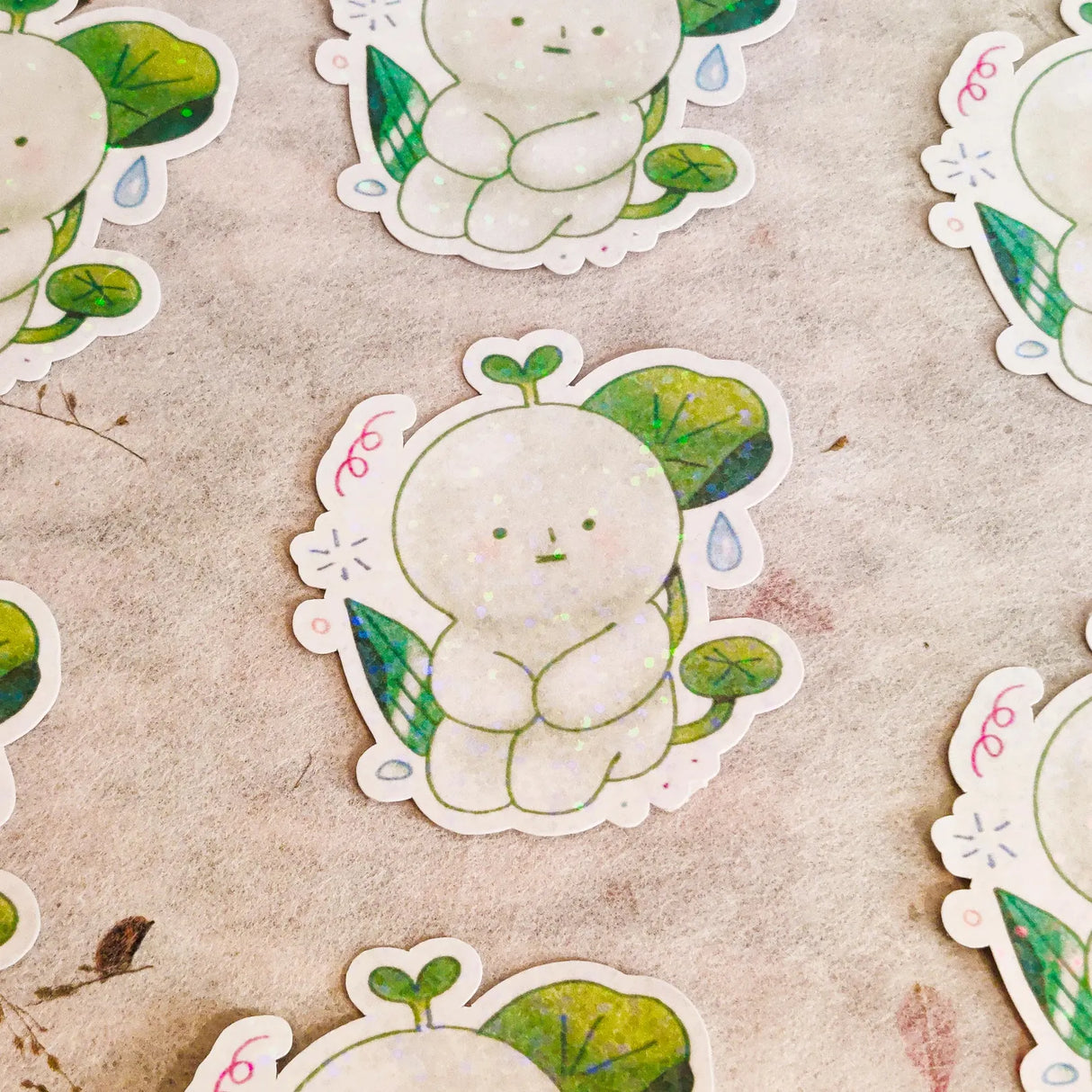 This is a glossy vinyl die-cut paper sticker with star holographic features, illustrated and made in-house by me. It's waterproof and ideal for decorating hard surfaces like laptops, water bottles, and phone cases, adding a cute touch to your belongings.&nbsp;

Material: premium glossy waterproof vinyl