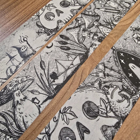 A unique and infinitely repeating fantasy landscape of melancholy oddities and curious characters, from original hand-drawn ink artwork by Jon Turner, recreated with incredible detail at miniature size in this washi tape that invites you to find new tiny details with every viewing.

This is a special extra-wide washi tape, 30mm high which really brings out all the tiny details. perfect for creating a decorative border when journalling, or for packing parcels with surreal style. 10m long.
