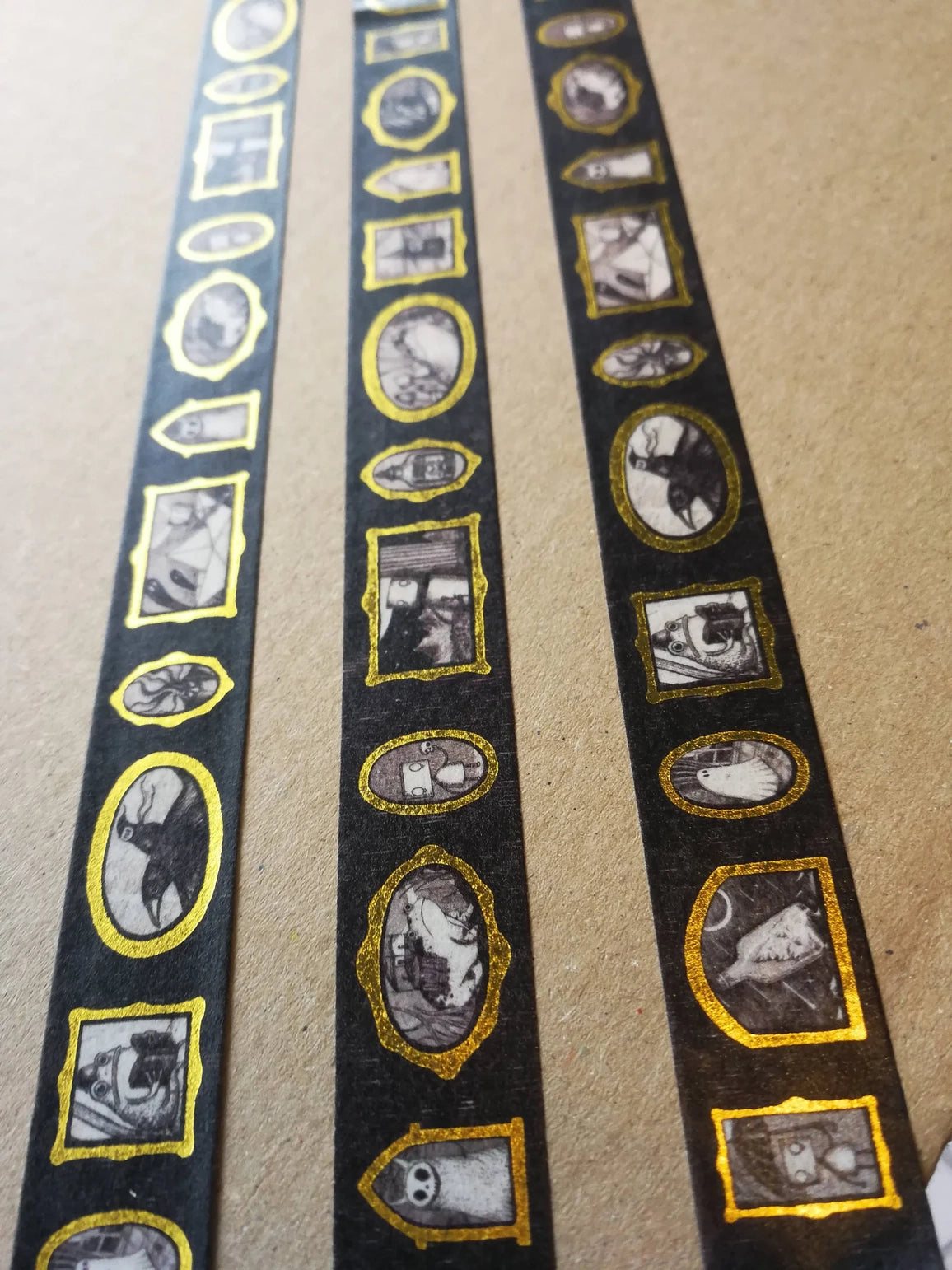 Jon Turner Gallery of Curiosities Gold Foiled Washi Tape - Style 2


Turn every surface into a tiny gallery with this washi tape featuring tiny Jon Turner artworks in shiny gold frames, an array of little robots, ghosts and other spooky oddities. Perfect for spooky journalling or curious correspondence.
15mm wide
10m length