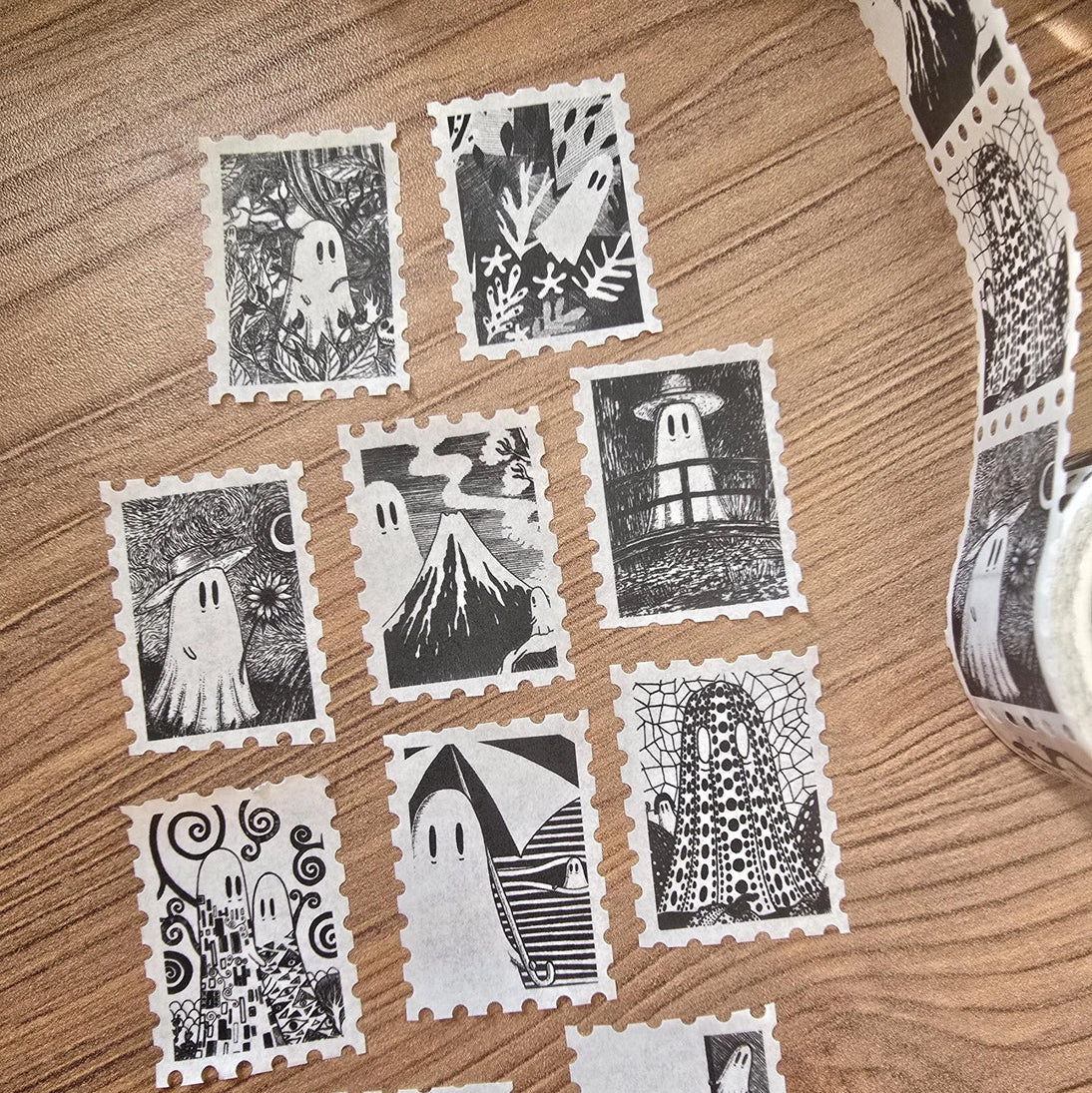 One of two tapes from the Creative Spirits series by Jon Turner, little ghosties taking you on an eclectic tour of art history. This roll features ghosts inspired by Vincent Van Gogh, Frida Kahlo, Piet Mondrian, Claude Monet, Henri Matisse, Hokusai, Malika Favre, Gustav Klimt, Keith Haring, and Yayoi Kusama.

Perforated to look like a roll of postage stamps, this washi tape features a repeating pattern of ten designs in portrait format from hand-drawn pen and ink artwork, recreated in incredible detail at m