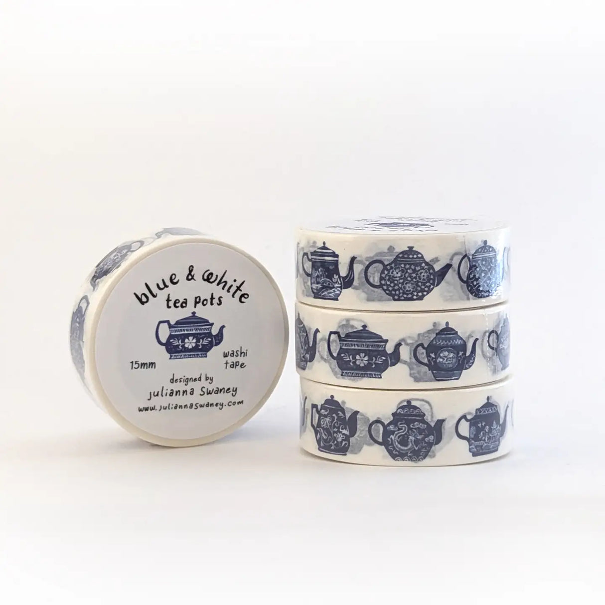 This tea themed washi tape is made from my original illustrations and it features a continuous parade of different styles of blue and white teapots on a white background.