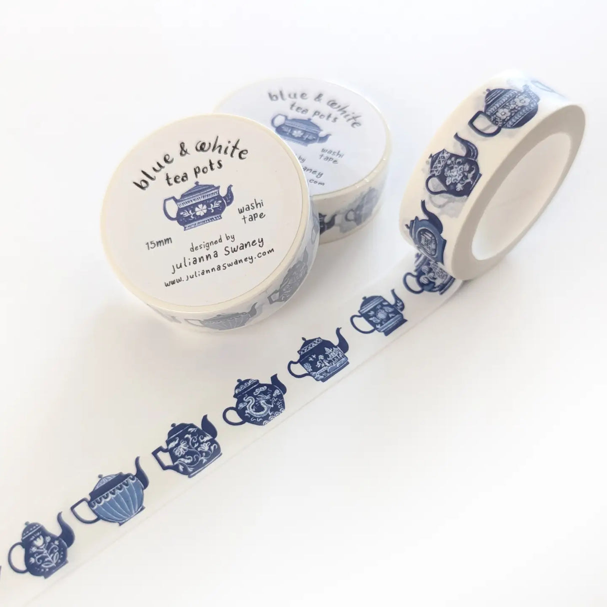 This tea themed washi tape is made from my original illustrations and it features a continuous parade of different styles of blue and white teapots on a white background.
