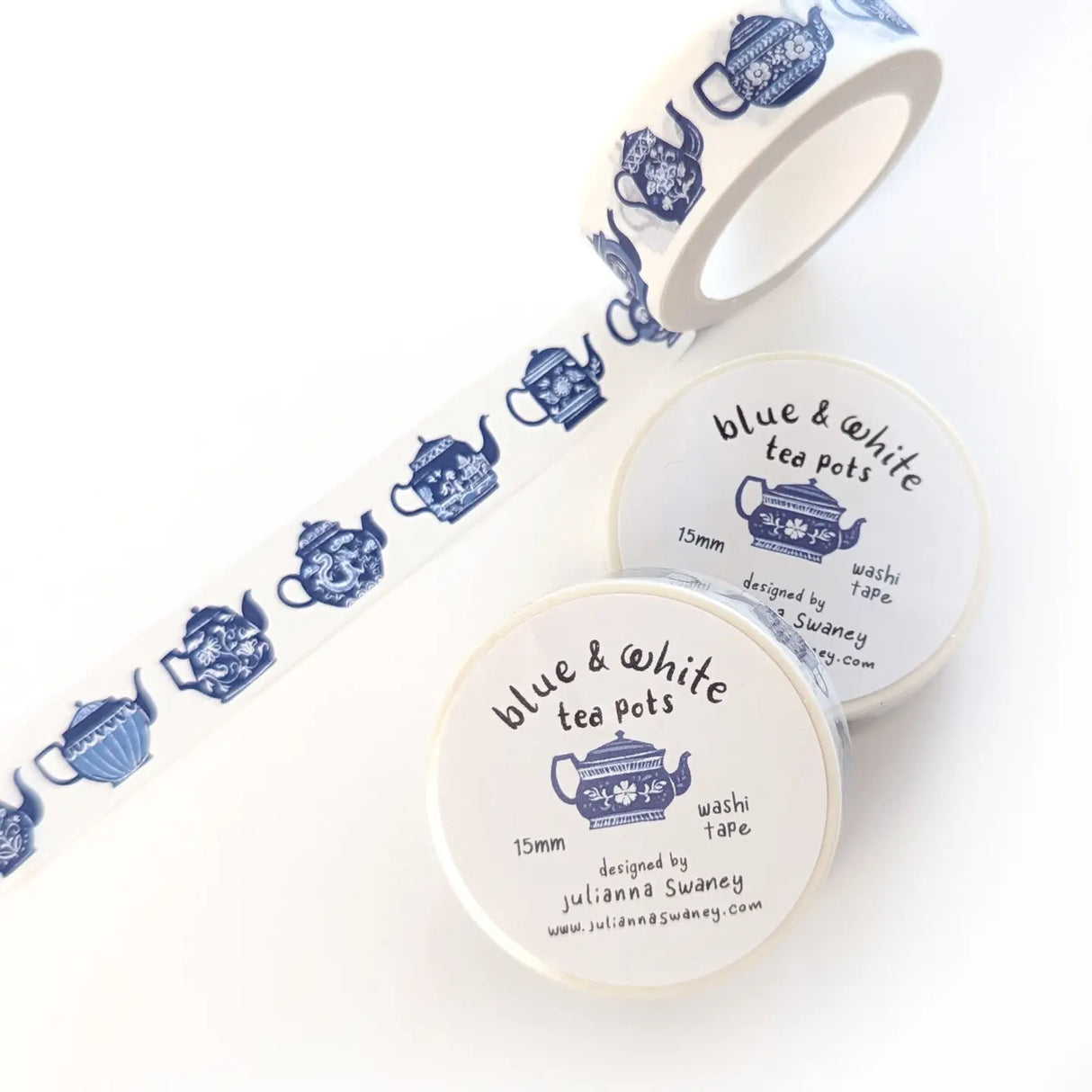 This tea themed washi tape is made from my original illustrations and it features a continuous parade of different styles of blue and white teapots on a white background.