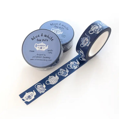 This tea themed washi tape is made from my original illustrations, and it features a continuous parade of different styles of blue and white teapots on a blue background.