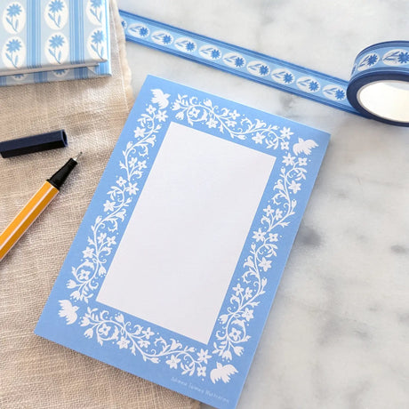 A simple tear away notepad for jotting down to do lists, things to remember, or a short Thank-You note. Illustrated with a pattern of birds, vines, and flowers.
