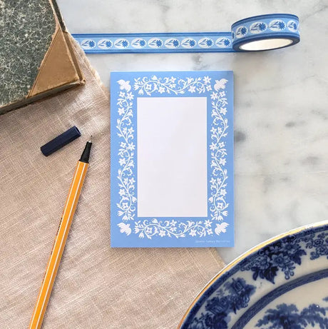 A simple tear away notepad for jotting down to do lists, things to remember, or a short Thank-You note. Illustrated with a pattern of birds, vines, and flowers.