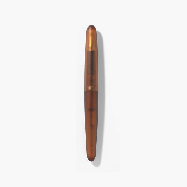 A pen that evokes the texture of frosted glass. Its translucency reveals the internal mechanism as an aesthetic feature. Careful consideration of form and colour palette ensures an elegant presence, even when not in use.&nbsp;

The pen is equipped with thoughtful functionality, including an extended grip section and a screw cap designed for quick access with minimal turns. The visible ink level allows for easy refills.

Available in a Fine and Medium nib
Includes converter
Steel nib