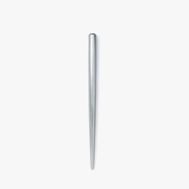 A nib holder that emerged from our desire to create a tool that inspires a lifetime of use, bringing joy to our hands and soul. From the timeless material to the comfortable thickness, form and length, each and every detail has been carefully considered to create a perfect fit. The 7-inch length is similar to that of a standard pencil. Designed to universal specifications to fit all standard nibs, the nib holder will travel with you for a lifetime of writing.&nbsp;

A nib holder machined from solid aluminiu
