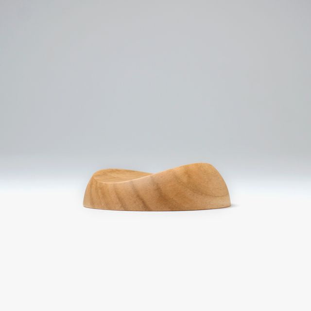 A pen rest that enhances the moments between writing. Designed to hold any pen without the need for precise placement, it blends effortlessly into your desk space with a subtle but assured presence. Enjoy the rich texture and wood grain of Japanese cherry.

Designed for stability to ensure your pens and surfaces are protected from accidental movement or damage. The pen rest comfortably holds two to three slender pens.

Use and Care:

To prevent distortion and discolouration, avoid soaking in water, sudden t