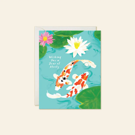 Karen Schipper Greeting Card - Koi Fish

Two koi swimming through lily pads and water flowers make this design feel peaceful, hopeful, and full of meaning. This hand-illustrated Koi Fish New Year card features orange-and-white koi in a turquoise pond with the front message “Wishing You a Year of plenty,” creating a thoughtful card for sending good luck, prosperity, and warm wishes.

A2 folded card, 4.25" W × 5.5" L
Printed in full color on FSC® certified white cover paper
Blank interior
Single greeting card