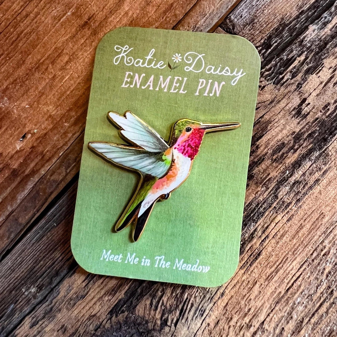 Hummingbird Enamel Pin by Katie Daisy

A tiny treasure to pin on your jacket, tote, or favorite old flannel—each one a little love letter to country delights, small joys, and the art of noticing.