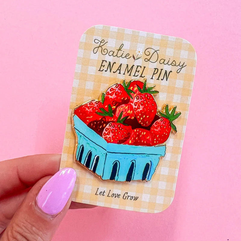 Strawberries Enamel Pin by Katie Daisy

A tiny treasure to pin on your jacket, tote, or favorite old flannel—each one a little love letter to country delights, small joys, and the art of noticing.