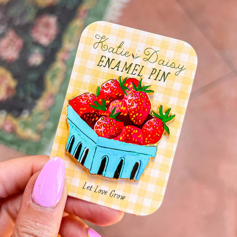 Strawberries Enamel Pin by Katie Daisy

A tiny treasure to pin on your jacket, tote, or favorite old flannel—each one a little love letter to country delights, small joys, and the art of noticing.