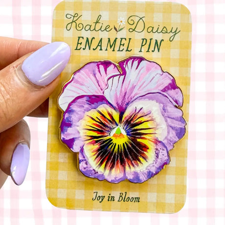 A tiny treasure to pin on your jacket, tote, or favorite old flannel—each one a little love letter to country delights, small joys, and the art of noticing.

Details:
• 1.75” on the longest side
• Gold-plated finish
• Rich, detailed UV printing
• Double pin posts with sturdy metal backings
• Mounted on a backing card


Designed with love in my Oregon studio. Manufactured in China.
Collect them all or gift one to a kindred spirit. 🌸