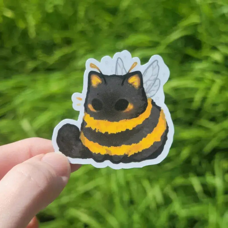 Katrina Wold Art - Tiny Cat Vinyl Sticker - Summer Bumblebee

2" matte vinyl sticker featuring a cute bumblebee kitty.

Matte laminated vinyl sticker
Waterproof, UV- and scratch-resistant
Features original, 100% hand-drawn art
Actual color may vary due to differences in lighting, device screen settings, etc.