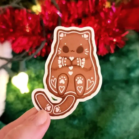 Katrina Wold Art - Tiny Cat Vinyl Sticker - Winter Gingerbread

Matte laminated vinyl sticker featuring a cute kitty gingerbread cookie.

Matte laminated vinyl sticker
Waterproof, UV- and scratch-resistant
Features original, 100% hand-drawn art
Actual color may vary due to differences in lighting, device screen settings, etc.