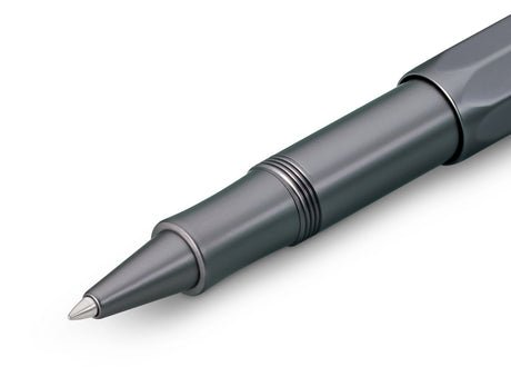 Contemporary design made of high-quality aluminium for an incomparable writing feel.

Our AL Sport roller ball anthracite is a pen to behold. The silky, glossy surface in a warm grey tone has an expressive and noble appeal. It is a perfect accessory for everyday use in the office, daily life, and leisure.

The metallic body is made of high-quality aluminium and grants an unique haptic experience. Its fine surface imparts elegance.

The Kaweco Sport was created in 1911. The pocket-sized roller ball pen only 