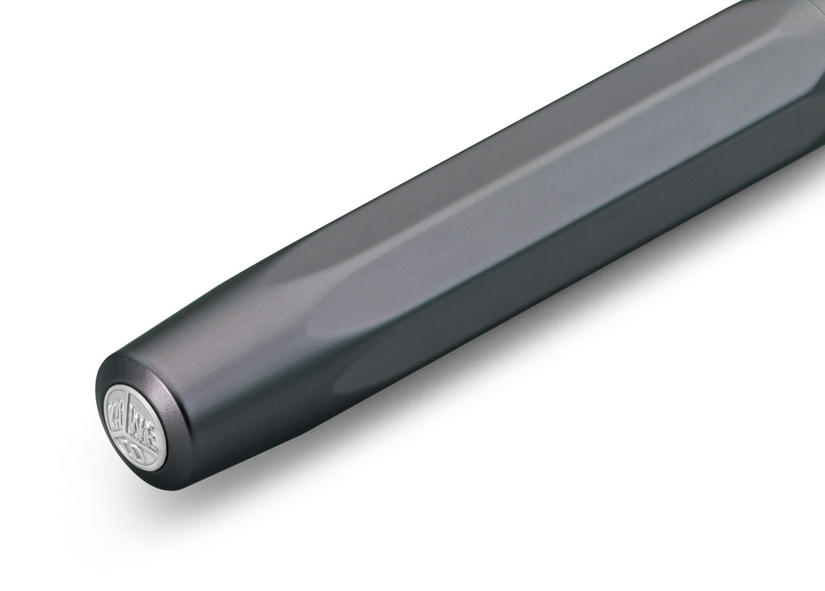 Contemporary design made of high-quality aluminium for an incomparable writing feel.

Our AL Sport roller ball anthracite is a pen to behold. The silky, glossy surface in a warm grey tone has an expressive and noble appeal. It is a perfect accessory for everyday use in the office, daily life, and leisure.

The metallic body is made of high-quality aluminium and grants an unique haptic experience. Its fine surface imparts elegance.

The Kaweco Sport was created in 1911. The pocket-sized roller ball pen only 