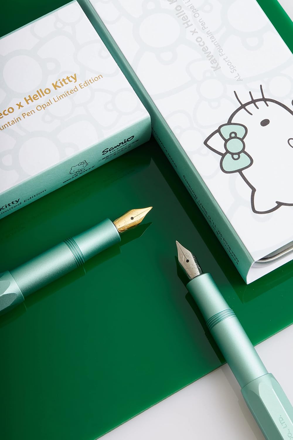 Hello Kitty meets Kaweco again to bring you the Limited Edition Kaweco AL Sport Fountain Pen. The aluminum body and cap are shaded in a unique Opal color. The cap features a Kaweco x Hello Kitty branding, and the silver-plated nib is engraved with Hello Kitty's adorable face.
