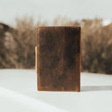 Kodiak Leather Drifter Leather Journal

The Drifter Leather Journal is designed for travelers, writers, and creatives who appreciate quality craftsmanship and timeless style. Made from top-grain leather, this beautifully crafted journal features a secure snap-button closure and handmade artisan paper, making it an ideal gift for adventurers and homebodies alike.

With 210 blank pages and a refillable design, it’s perfect for capturing thoughts, sketches, or travel memories. Measuring 7” x 5” x 2.5”, the Dri