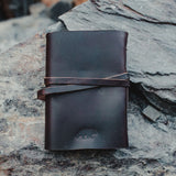 Kodiak Leather Traveler's Journal - Large

The Kodiak Traveler Journal is the perfect travel companion. Made with durable top grain leather, a leather wrap closure and handmade artisan paper this journal is the ultimate gift item for the world traveler or home-body.

• 110 blank pages
• Made with handmade artisan paper
• Top Grain Leather
• Dimensions: 8" x 6" x 1.75"