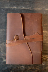 Kodiak Leather Traveler's Journal - Medium

The Kodiak Traveler Journal is the perfect travel companion. Made with durable top grain leather, a leather wrap closure and handmade artisan paper this journal is the ultimate gift item for the world traveler or home-body.

• 110 blank pages
• Made with handmade artisan paper
• Top Grain Leather
• Dimensions: 5" x 7"