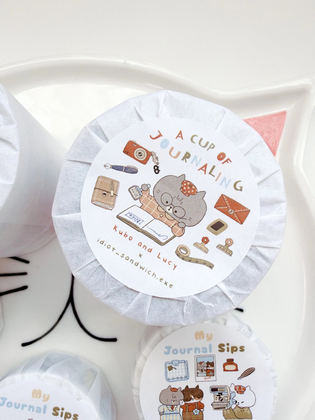 A Cup of Journaling P.E.T Tape, a collaboration with Idiot Sandwich

Add a touch of seasonal whimsy to your creative projects with Our first collaboration with Idiot Sandwich, an Illustrator from Vietnam. Thao illustrations captures everything Kubo and Lucy is about, coffee, stationery and journaling. This P.E.T tape is perfectly Kiss Cut, for easy use.