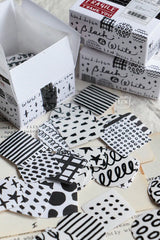 A mini package box full of black and white stickers!
How cute is that!
It has everything: a fragile sticker, shipping label, and even an invoice!
That invoice is also a sticker!
