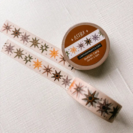 Removable Washi craft tape for journaling and gift wrapping; featuring whimsical celestial stars on a cream background.

15mm x 10m
Shrink wrap packaging with label