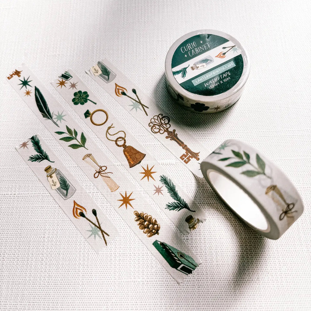 Removable Washi craft tape for journaling and gift wrapping; featuring curios, specimens, and trinkets on an off-white background.

15mm x 10m
Shrink wrap packaging with label
