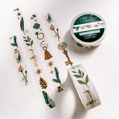 Removable Washi craft tape for journaling and gift wrapping; featuring curios, specimens, and trinkets on an off-white background.

15mm x 10m
Shrink wrap packaging with label