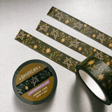 Removable Washi craft tape for journaling and gift wrapping; featuring dandelions and pentagrams on a dark green background.