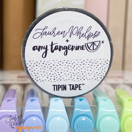 Do you love adding interactive elements to your scrapbook layouts like photos, journaling cards, patterned paper, ephemera, and keepsakes, but want a clean, professional way to attach them without bulky adhesives or visible hinges?

Tip In Tape™ was designed for exactly that.

Tip In Tape™ is a clear matte PET tape created for adding interactive elements to scrapbook pages and paper crafting projects with precision and ease. It allows you to create flip-ups, tip-ins, layered details, and movable elements wh