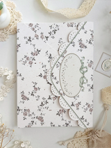 lily&nbsp;of the valley fabric notebook cover. sewn together with careful craftsmanship. lined with lace ruffles for that extra romantic, cottage-core, fairytale touch. meant to protect your notebooks &amp; a keepsake for your beloved stationery :)

♡ floral linen pattern with ruffle lace edging &amp; lily of the valley embroidery

♡ lace ribbon enclosure to help keep your notebooks closed

♡ 7 pockets total (left sleeve: 5 pockets | right sleeve: 2 pockets)

♡ x1 lace ribbon book mark with gold bow pendant