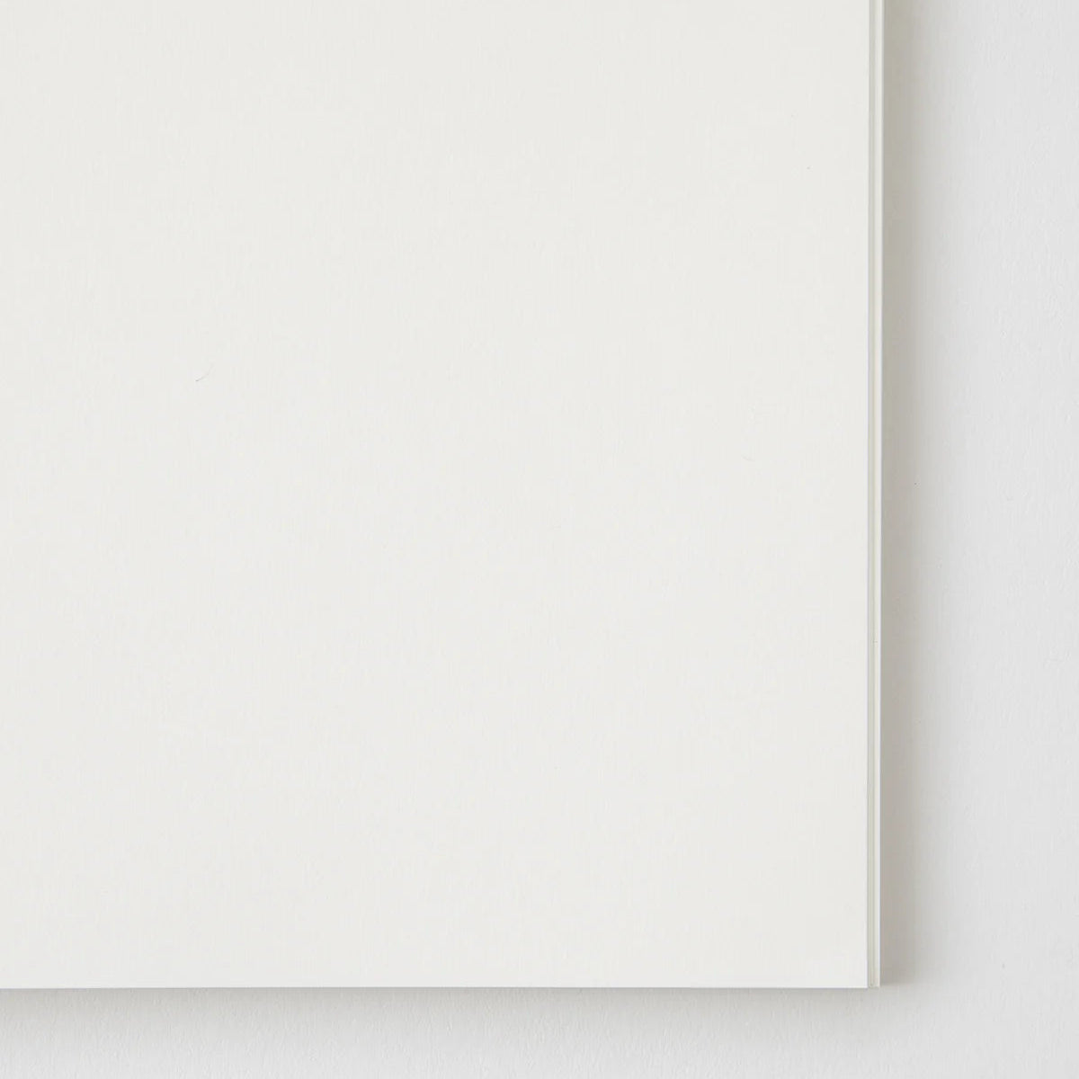 Crafted in Japan, this minimalist notebook is designed to enhance your writing experience. Inside, you'll find the high-quality Midori Diary (MD) paper, first developed in 1960 and refined ever since. Midori has rigorously tested this paper with various writing instruments to ensure quality, checking for ink feathering or bleeding, drying time, the smoothness of pen tips on the surface, and the tactile feel. The result is a paper that resists bleeding and feathering and is fountain-pen friendly, ensuring a 