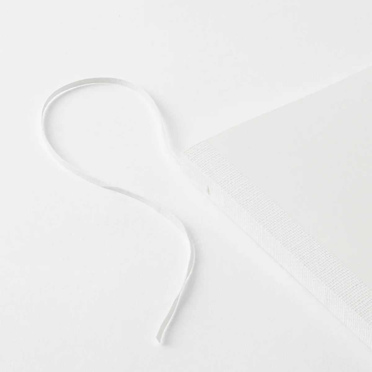 Crafted in Japan, this minimalist notebook is designed to enhance your writing experience. Inside, you'll find the high-quality Midori Diary (MD) paper, first developed in 1960 and refined ever since. Midori has rigorously tested this paper with various writing instruments to ensure quality, checking for ink feathering or bleeding, drying time, the smoothness of pen tips on the surface, and the tactile feel. The result is a paper that resists bleeding and feathering and is fountain-pen friendly, ensuring a 