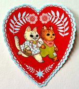 Two cats go for a walk on this folk art inspired sticker.

This vinyl matte sticker is weather and waterproof-stick it on a notebook, bike, or car- it's going to stick around! Heck, throw it on a water bottle and through the dishwasher. This sticker can go anywhere. Sticker measures 3.5" x 4.5" Printed in USA.