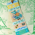 A dragon on an adventure! This dragon is great at keeping your place in your favorite book. Perfect for book lovers! This bookmark has the same image on both sides.

Printed on heavy cardstock and comes with a tassel, these bookmarks measure 2x6 inches.&nbsp;

Printed in USA