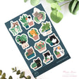 This vinyl sticker sheet features cats and plants. Brighten up your belongings with these sweet, durable stickers that stick to laptops, water bottles, journals, and more.&nbsp;

4x6 Sheet
Vinyl Sticker
Colors might vary just a bit from your screen.