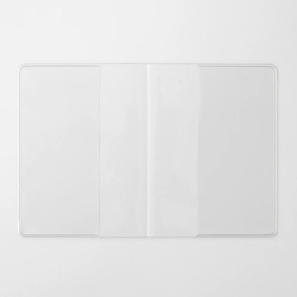 A transparent cover that fits snugly around your MD Notebook

This is a special cover that gently wraps your MD Notebook. The transparent cover protects the notebook from dirt without ruining its appearance.
It subtly protects your notebook from water and dirt without interfering with its characteristics. If you put the cover on with the glassine paper still wrapped around it, the inorganic feel of the vinyl will be softened.
Because it is transparent, you can enjoy the cover design, illustrations, and writ