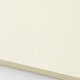 Crafted in Japan, this minimalist notebook is designed to enhance your writing experience. Inside, you'll find the high-quality Midori Diary (MD) paper, first developed in 1960 and refined ever since. Midori has rigorously tested this paper with various writing instruments to ensure quality, checking for ink feathering or bleeding, drying time, the smoothness of pen tips on the surface, and the tactile feel. The result is a paper that resists bleeding and feathering and is fountain-pen friendly, ensuring a 