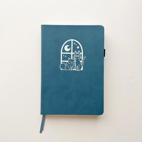 Jiji The Cat Journal in Ocean Blue with Holographic Edges and Logo 🌊✨

Product Details:

Size: A5 (5.70 x 8.26 inches)
160 Dotted Grid Pages (5 x 5 mm)
2 Bookmarks
Elastic Band and Pen Holder
Expandable storage compartment