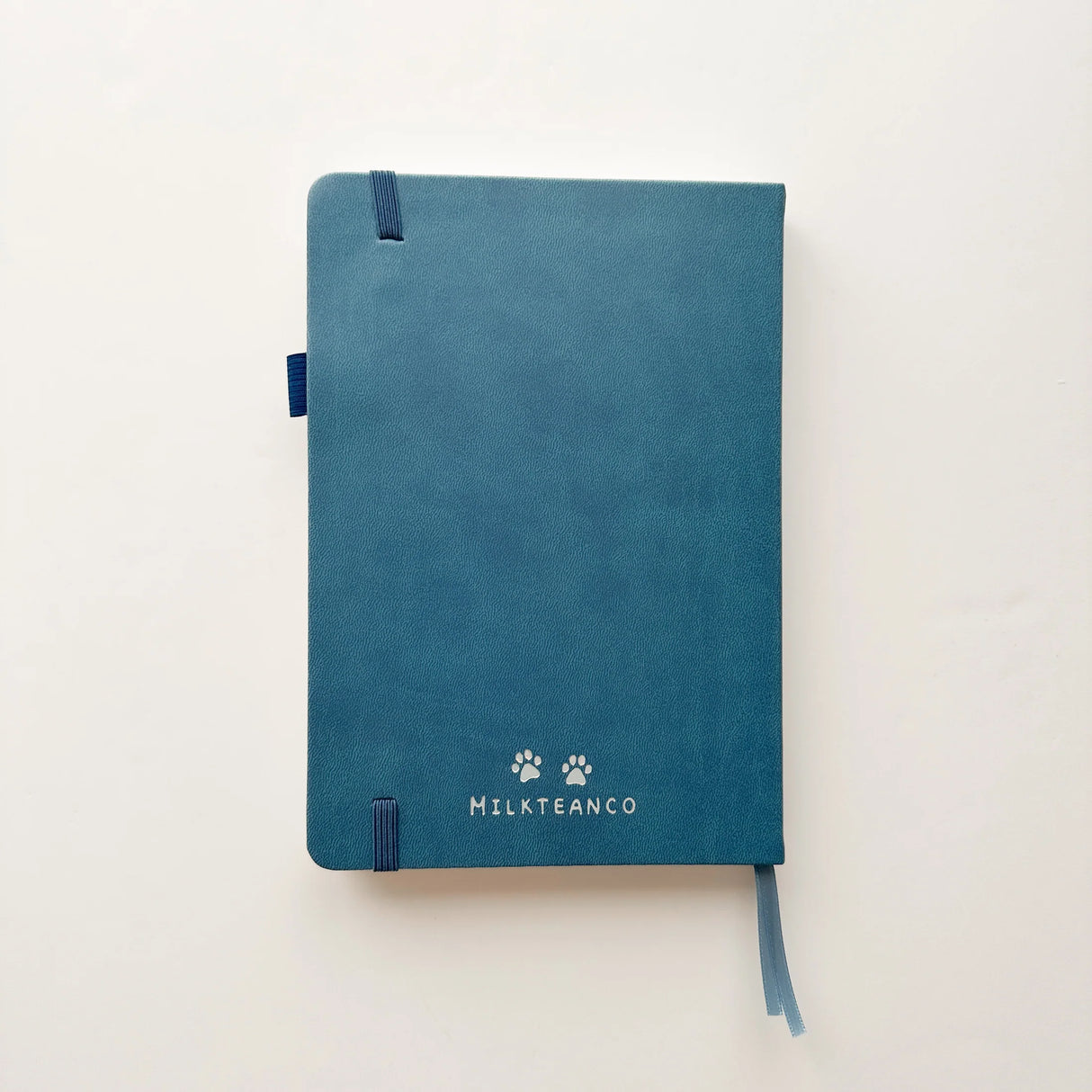Jiji The Cat Journal in Ocean Blue with Holographic Edges and Logo 🌊✨

Product Details:

Size: A5 (5.70 x 8.26 inches)
160 Dotted Grid Pages (5 x 5 mm)
2 Bookmarks
Elastic Band and Pen Holder
Expandable storage compartment
